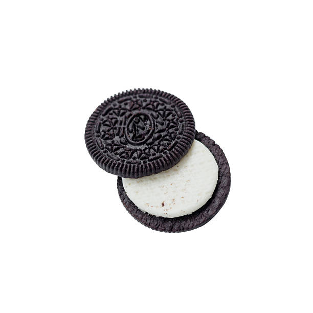 istock Chocolate cookies with creme filing isolated on white 576605716