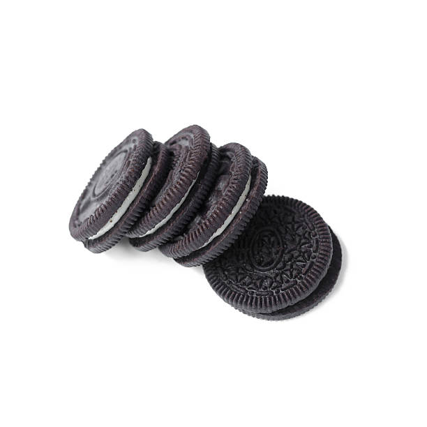 istock Chocolate cookies with creme filing isolated on white 576605764