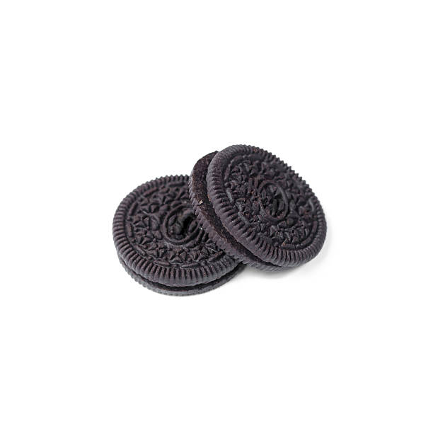 istock Chocolate cookies with creme filing isolated on white 576605822