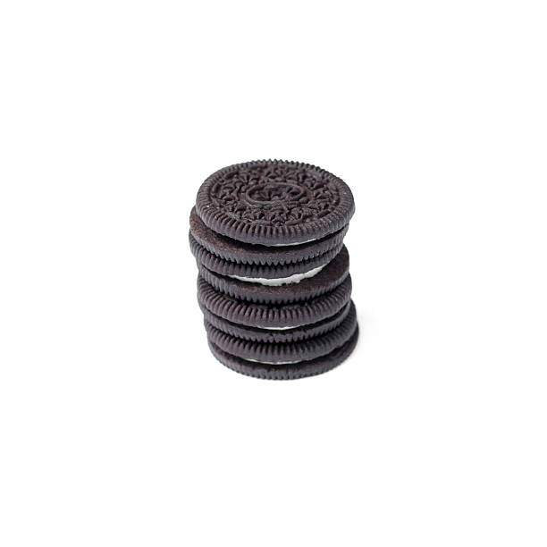 istock Chocolate cookies with creme filing isolated on white 576605850