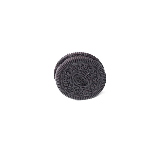 istock Chocolate cookies with creme filing isolated on white 576605906