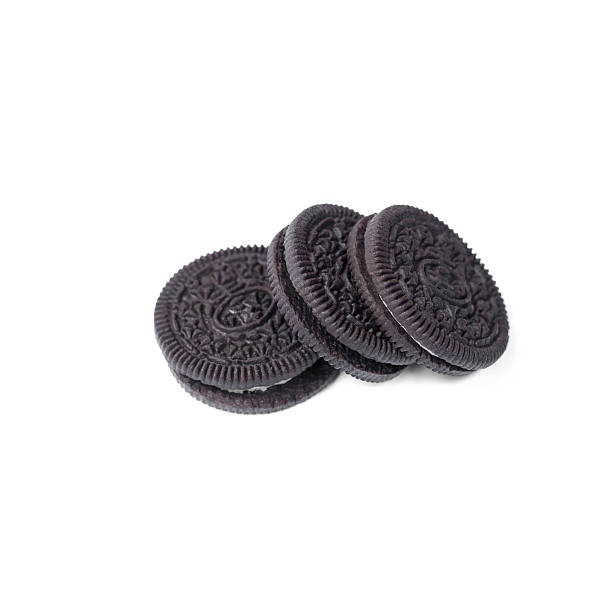 istock Chocolate cookies with creme filing isolated on white 576605940