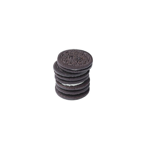 istock Chocolate cookies with creme filing isolated on white 576606024