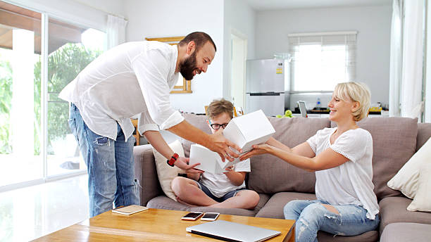 istock Family at home playing with virtual reality headsets. VR. 576607062