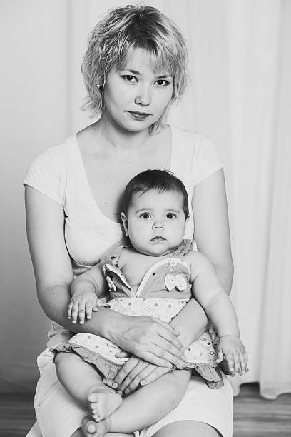 istock daughter on hands in mamy retro photos 576607578