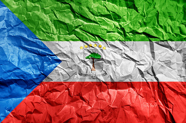 Equatorial Guinea flag painted on crumpled paper background