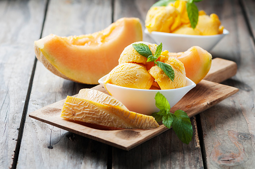 Fresh ice-cream with melon and mint, selective focus