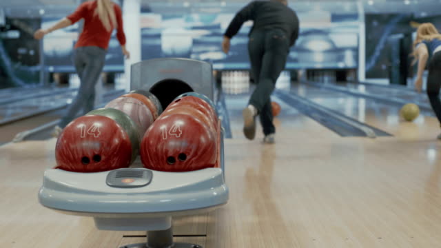 Friends playing bowling game