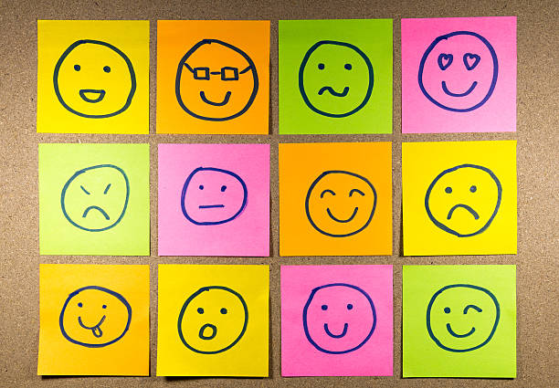 istock Sticky Note Emoticons on cork bulletin board 576709180
