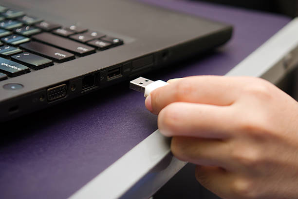 istock USB stick or USB thumb drive plug in to laptop 576710314