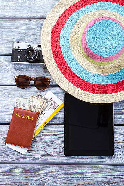 istock Passport and striped beach hat. 576710776