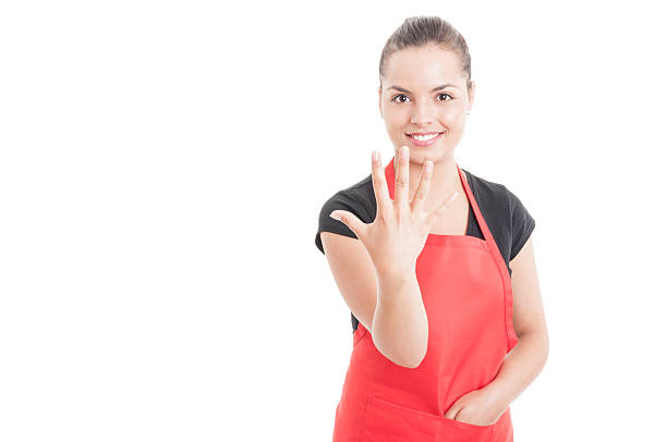 istock Cheerful hypermarket employee rising five fingers 576710826