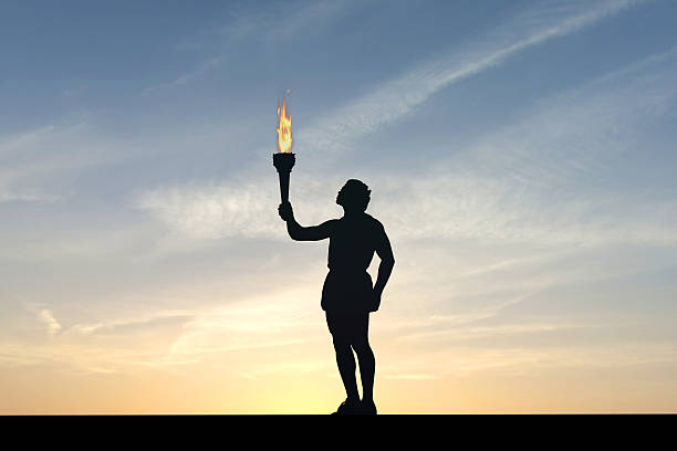 Athlete holding a flaming torch silhouette