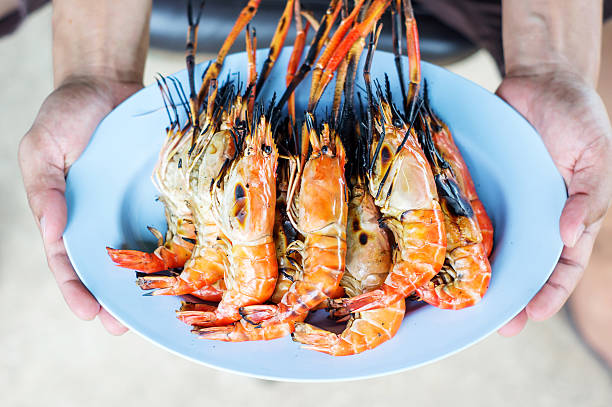 istock Grilled shrimps on the blue plate. 576713812