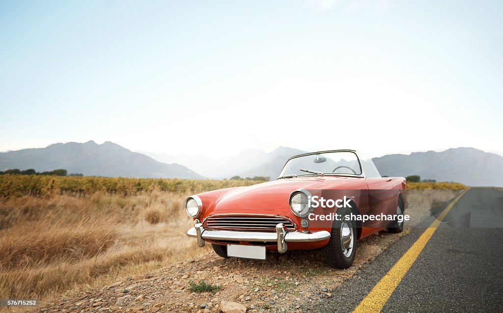 Life’s better in a classic Shot of a vintage car parked on the side of the road Vintage Car Stock Photo