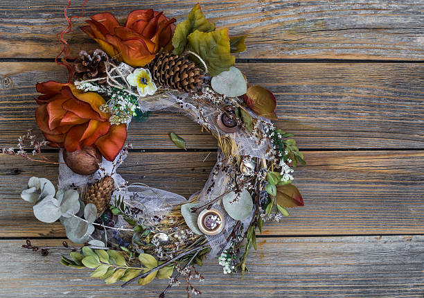 istock autumn wreath on wooden background 576715762