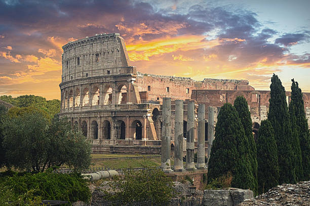 The Colosseum in Rome at Sunset The Colosseum or Coliseum, also known as the Flavian Amphitheatre, is an oval amphitheatre in the centre of the city of Rome, Italy. Built of concrete and sand, it is the largest amphitheatre ever built. ancient rome photos stock pictures, royalty-free photos & images