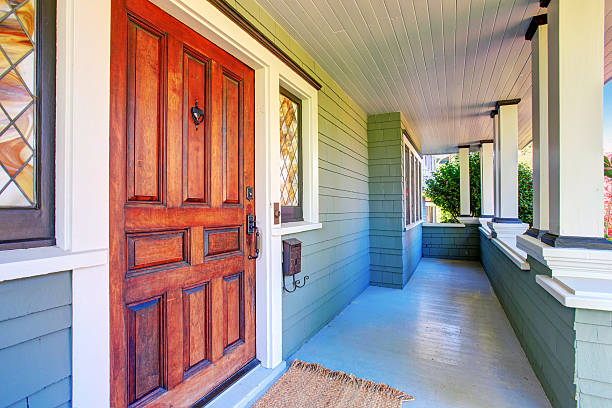istock House exterior. Perfect covered porch with white columns 576716342