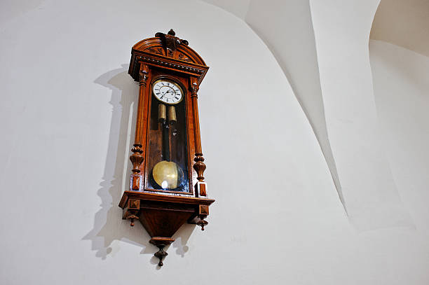istock Vintage antique wood clock on wall 576717544