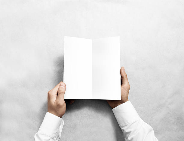 istock Hand opening blank white flyer brochure booklet mockup. 576719454