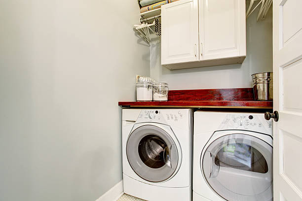 istock laundry room with tile floor, door, and washer dryer set. 576720022