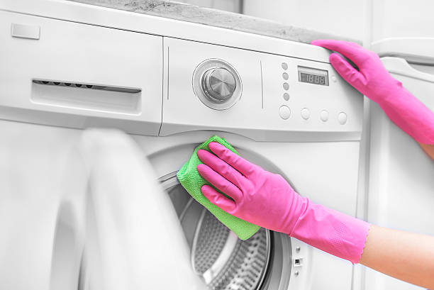 istock Female hand wash washing machine. 576722088