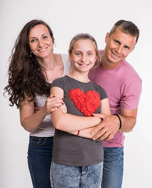 istock Happy family posing on white 576722310