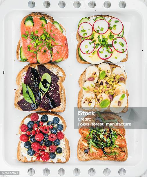 Sweet And Savory Breakfast Toasts Assortment Sandwiches With Fruit Vegetables Stock Photo - Download Image Now