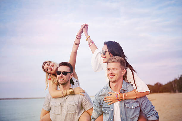 istock Boys carrying their attractive girlfriends 576723630