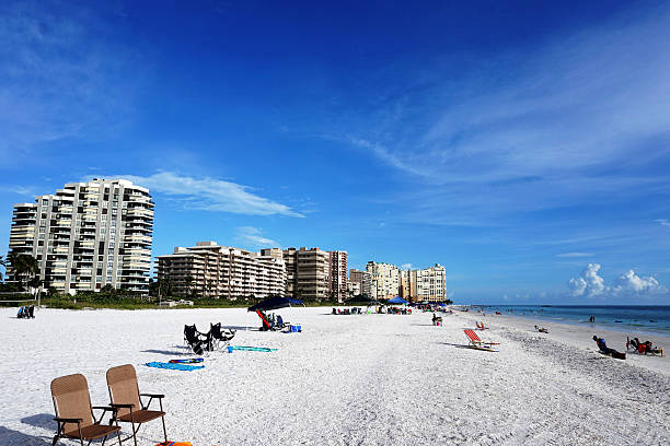 istock Florida white sand beach with waterfront apartments 576723950