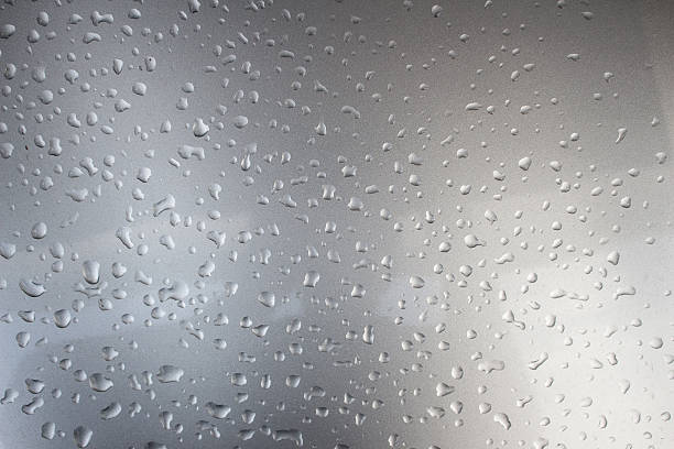 istock water drops on gray metal background. 576724524