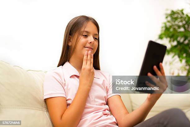 Smiling Deaf Girl Talking Using Sign Language On Digital Tablet Stock Photo - Download Image Now