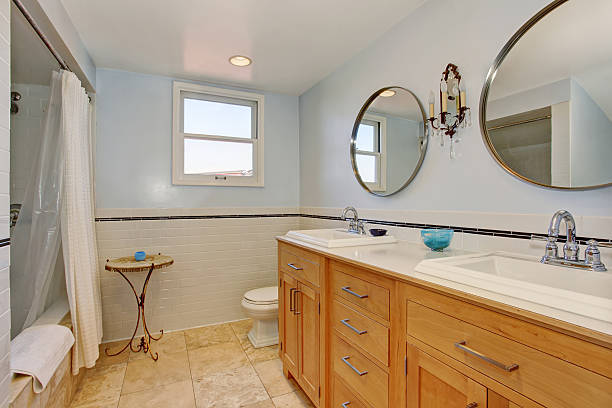istock Bright bathroom in blue tones with cabinets and shower. 576724862