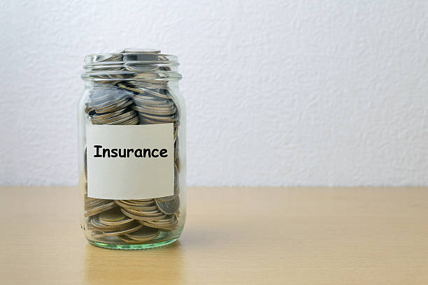istock Money saving for Insurance in the glass bottle 576725314