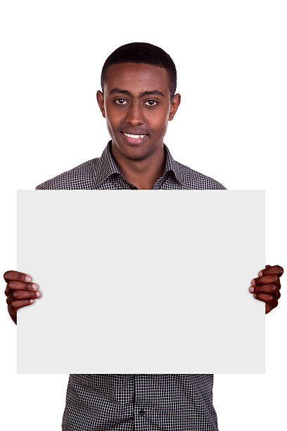 istock Smiling man holding blank cardboard paper 576726828