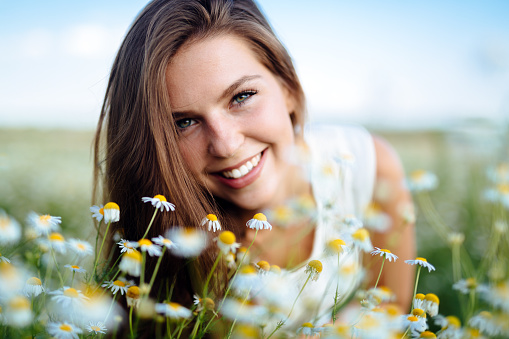 Beautiful woman in field with no allergy symptoms