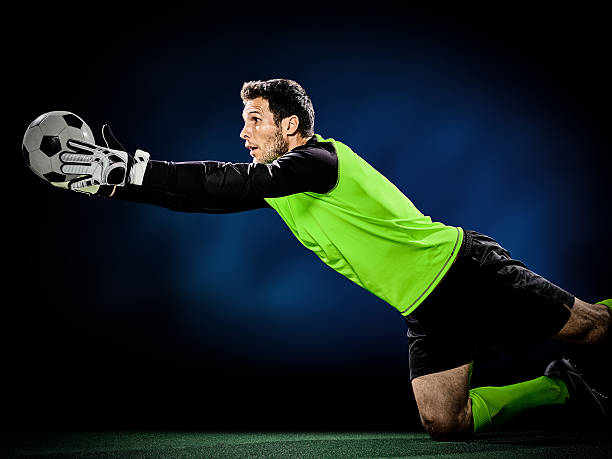Portrait of Brazilian goalkeeper on soccer field training and posing for pictures.