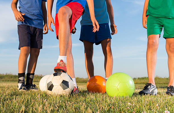 istock Boys playing football 576728350