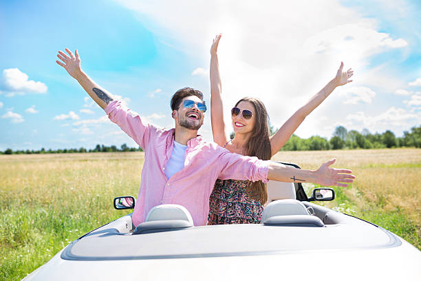 istock Couple enjoying a drive in a convertible 576728896