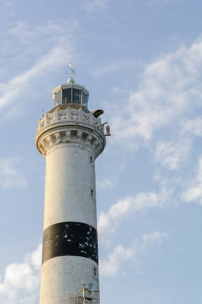 istock high white stone lighthouse against a blue evening sky with 576731280