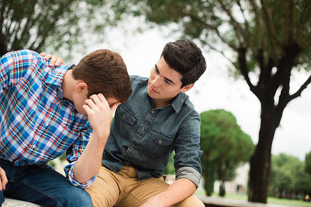 istock Young man concerned about his friend 576732162