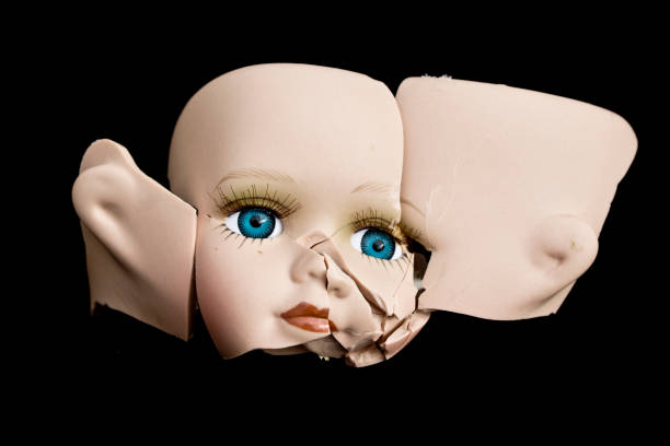 istock Broken Doll Face and Head on Black Background 576732860