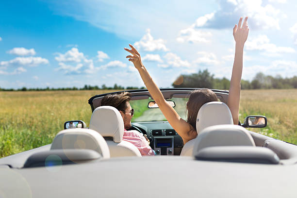 istock Couple enjoying a drive in a convertible 576733416