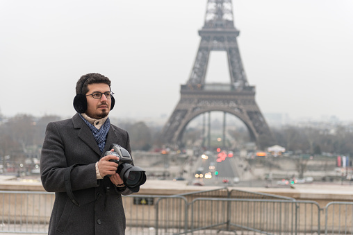 Photographer in front of Eiffel Tower, Paris, France