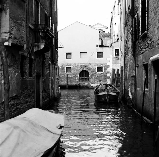 istock Venice canal with gondola in b/w 576735468