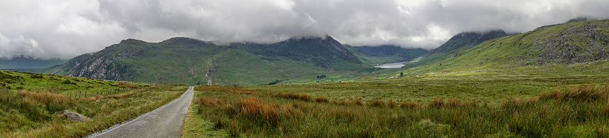 Taken from a track that leads to a reservoir this is a panaramic image of the Ogwen valley in north Wales. Tryfan can be seen can be seen in the middle of the image.