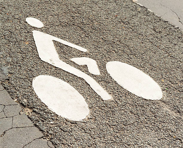 istock Cycle lane sign on tarmac road surface 576741468
