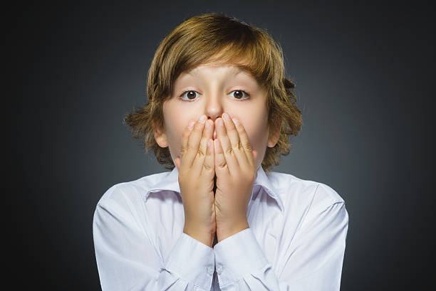 istock Closeup Portrait of handsome boy with astonished expression while standing 576741782