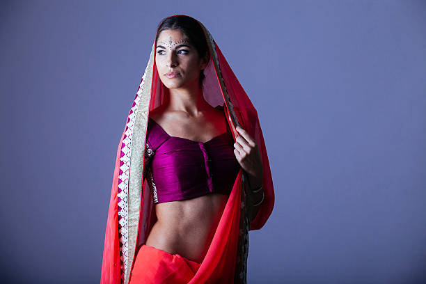 istock beautiful indian woman in bright clothes 576744196