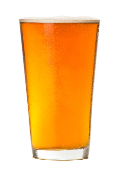 pinta di ambra ale su bianco - amber beer foto e immagini stock